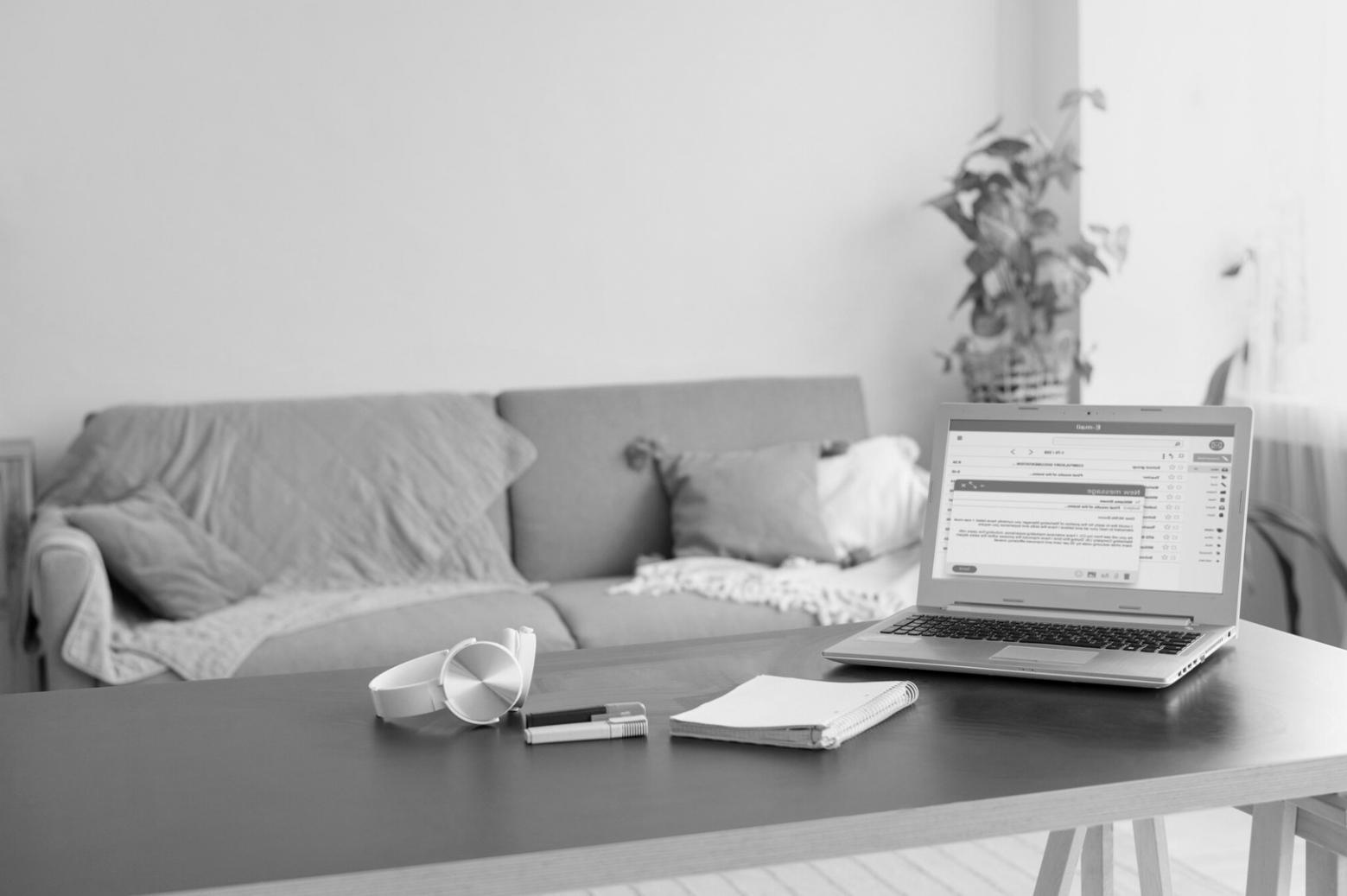 Person reviewing budget spreadsheet with coffee